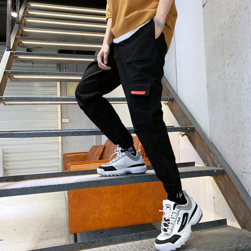 Men's black cargo trousers with knee panel and side rectangle patch
