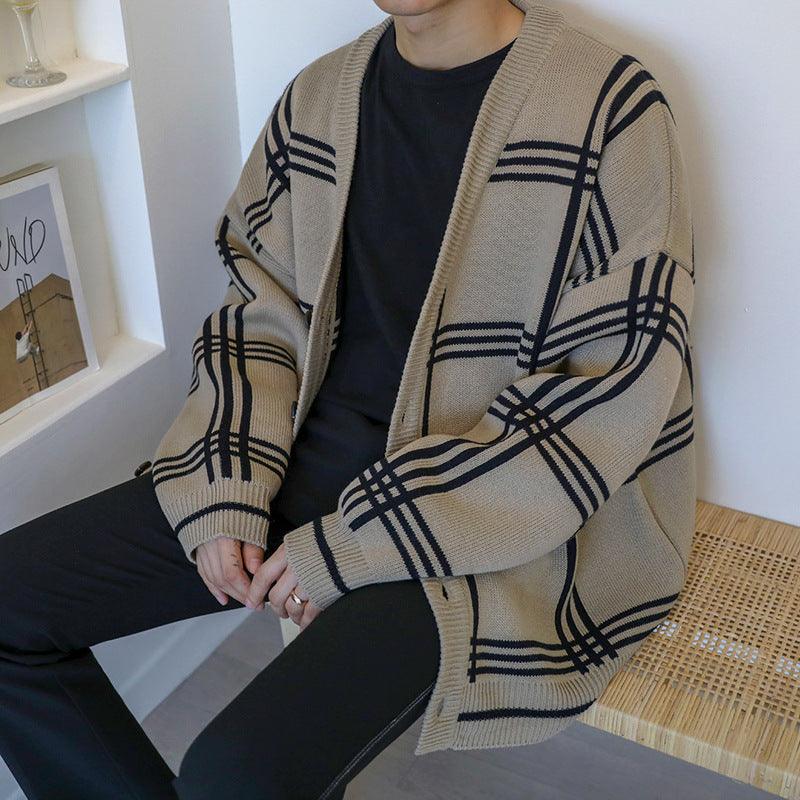 Beige knit cardigan with black plaid pattern, button-front and ribbed sleeve cuffs