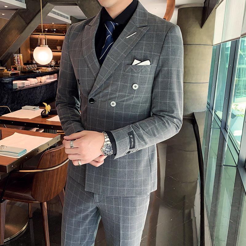 Dark gray plaid three-piece suit with double-breasted blazer, vest, and matching trousers