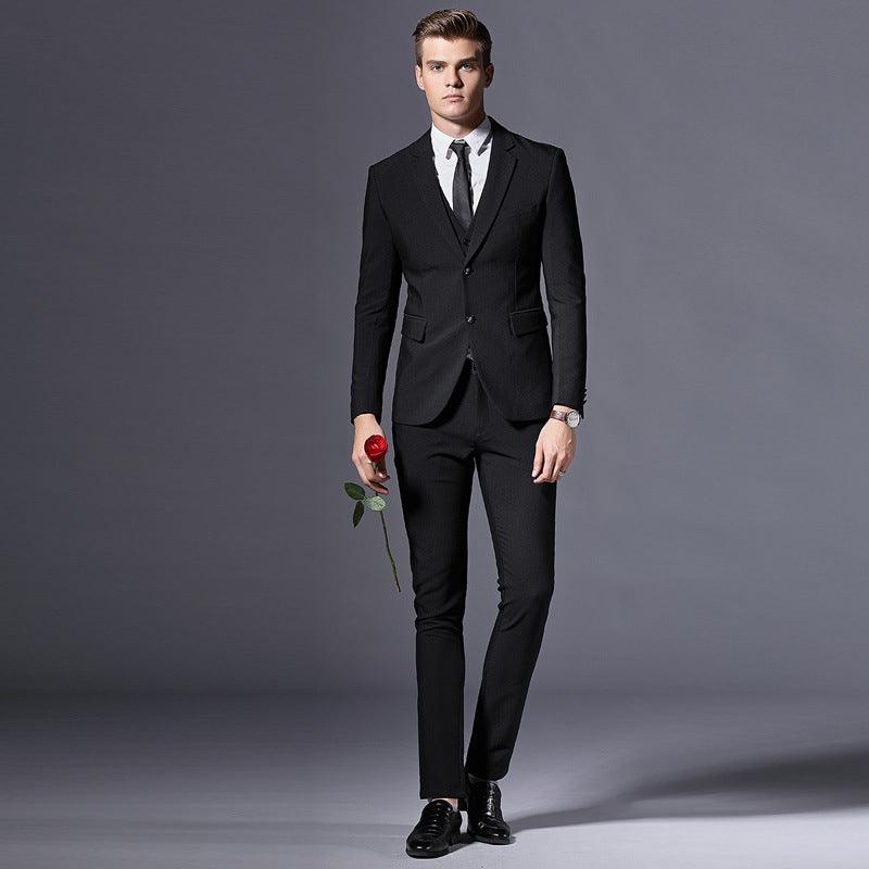 Black men's suit with notch lapels, vest, and matching trousers