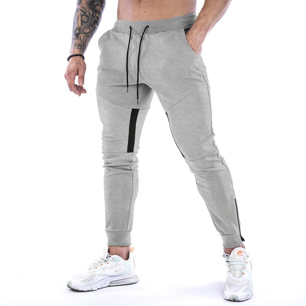 Men's fitness trousers in light grey, drawstring waist, cuffed jogger hems