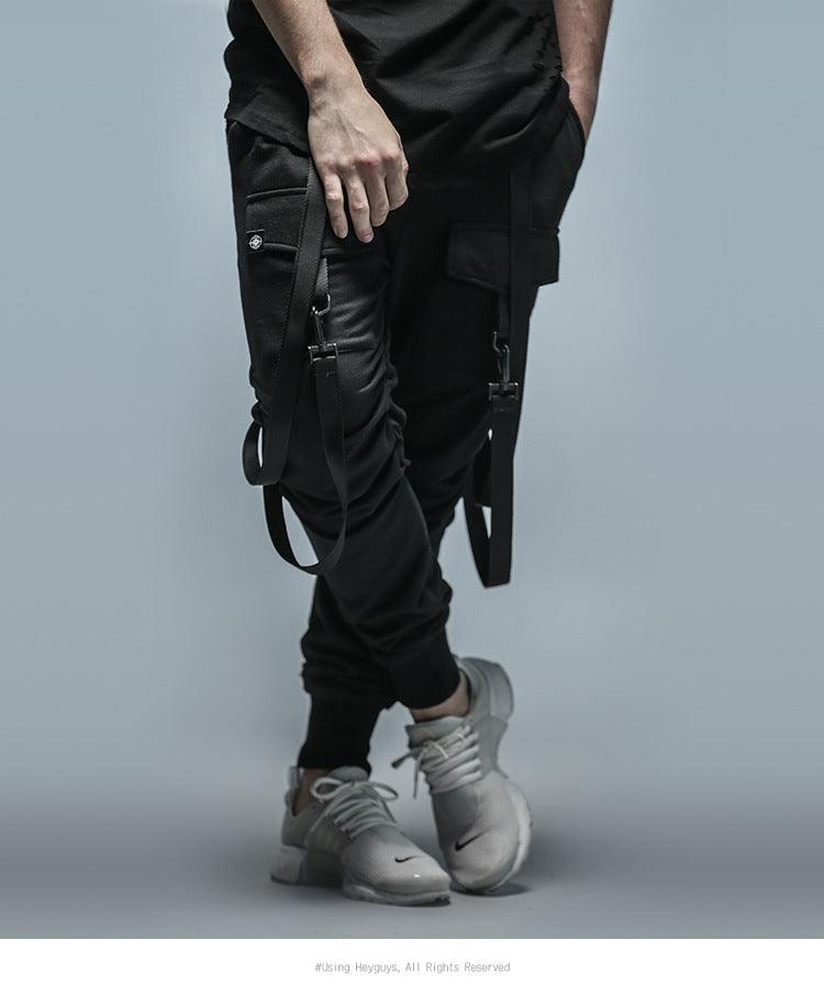 Men's black cargo jogger pants with side straps and multiple zip pockets