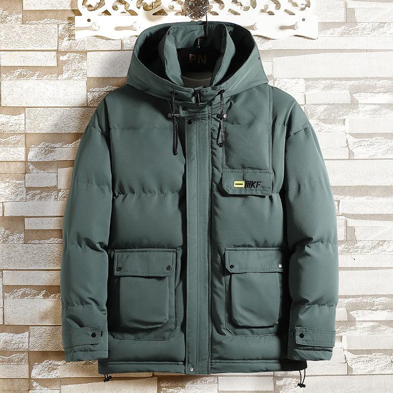 Women’s teal padded jacket with hood and full-zip front, flap pockets on chest