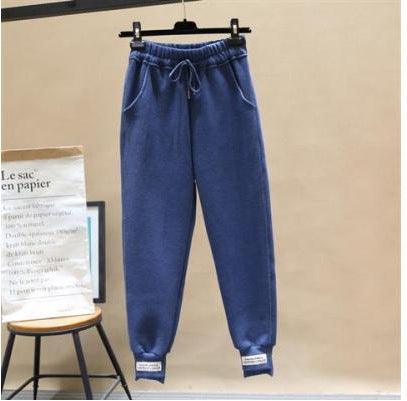 Navy blue harem jogger trousers with elastic waistband and drawstring, cuffed hems