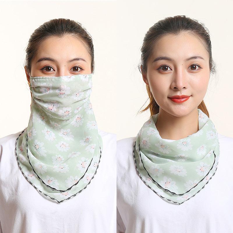 Soft green floral bib scarf with matching face covering, draped around neck