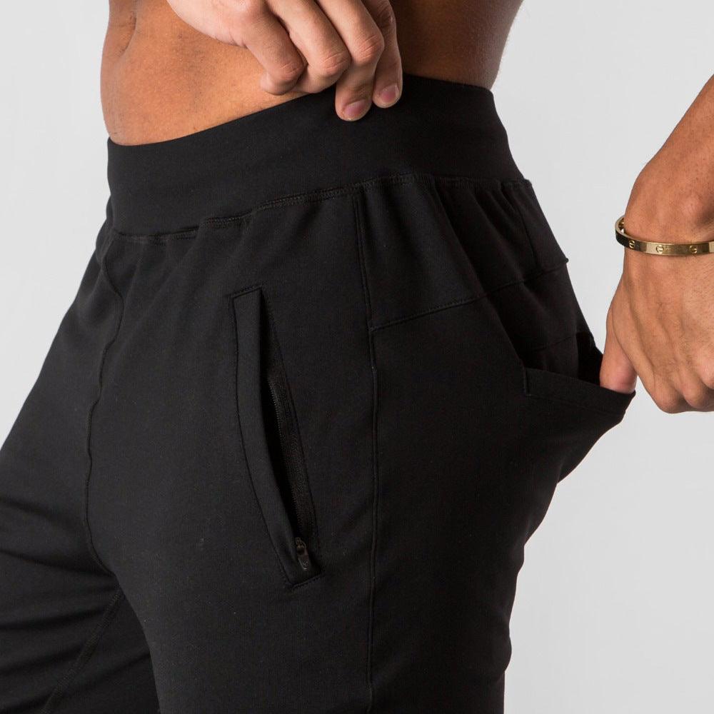 Men's sports trousers in black, elastic waistband with side zip pockets