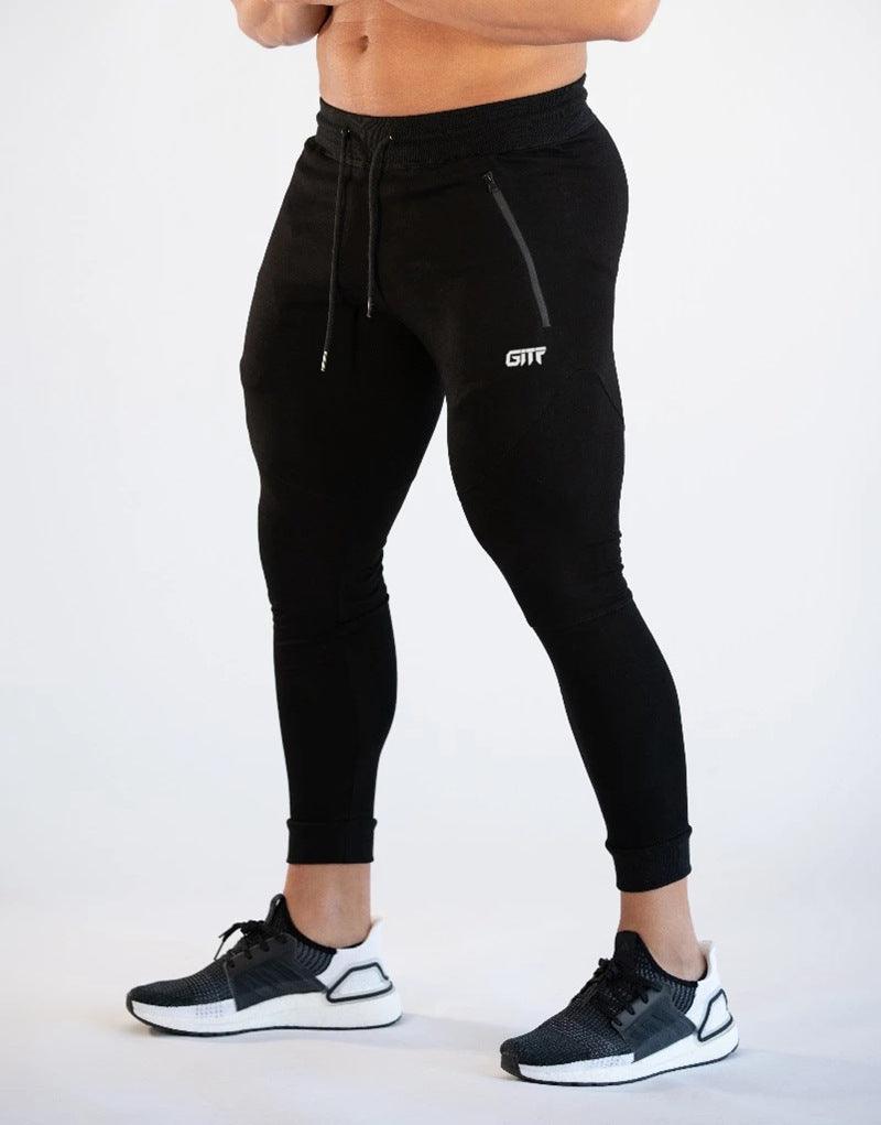 Black sport pencil pants with drawstring waist and slim cuffed legs.