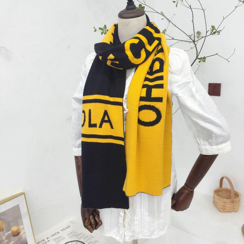 Black scarf with bold yellow letters and striped ends