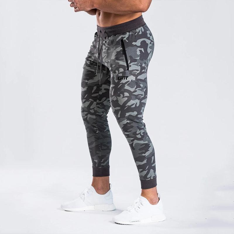Grey camouflage sport pencil pants with drawstring waist and tapered cuffed legs.