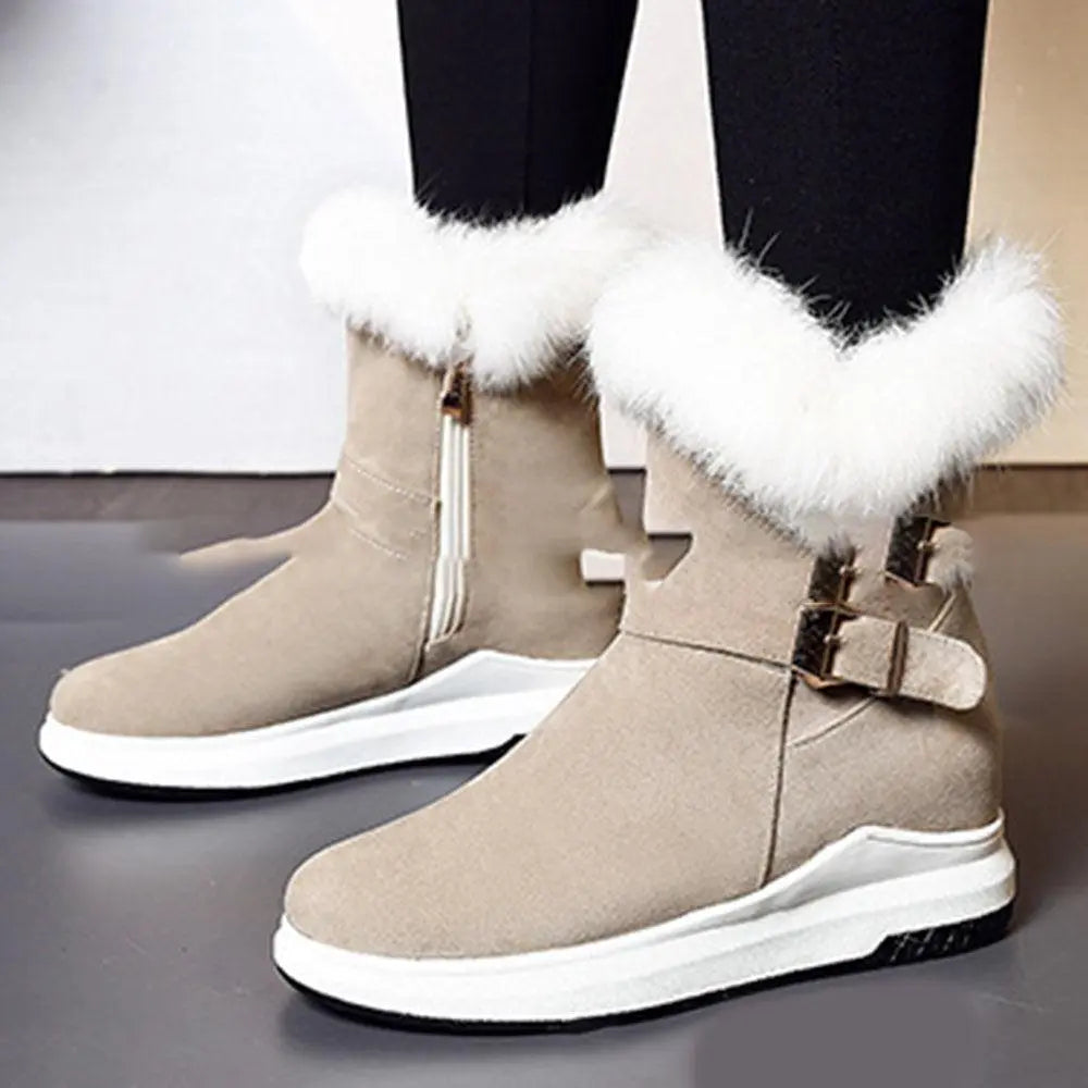 Light beige suede snow boots with white faux-fur cuffs and buckle straps; thick sole
