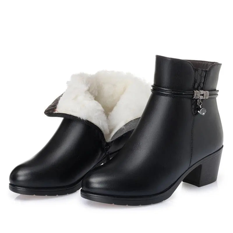 Black ankle boots with thick block heel and white faux-fur lining