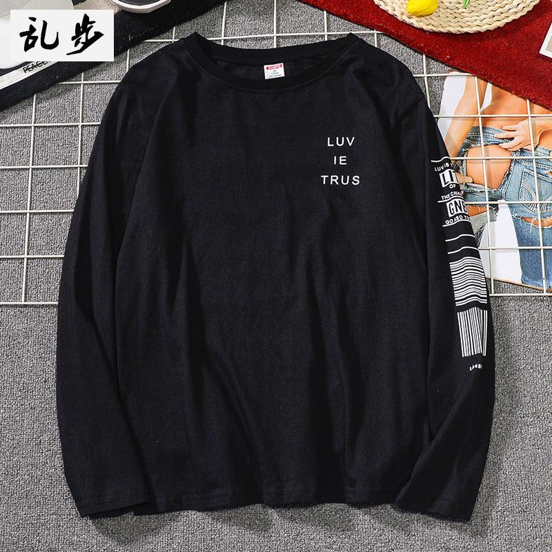Black long-sleeve shirt with stacked text 'LUV IE TRUS' on chest.