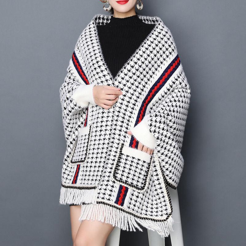 Thick houndstooth shawl, white knit with black pattern, red striped trim, fringed hem