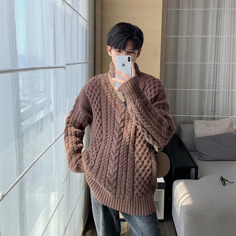 Brown turtleneck cable-knit sweater with long sleeves and vertical cable design
