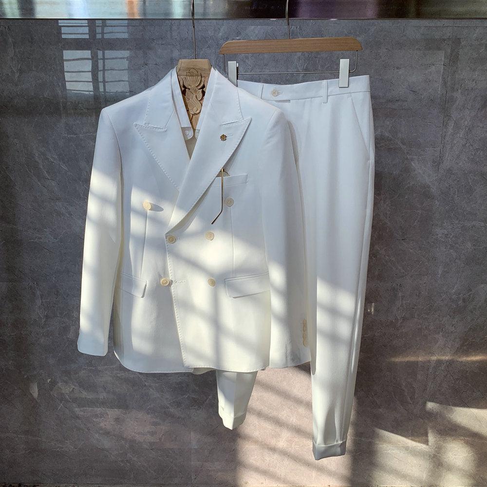 White tailored blazer and matching trousers set, gold-tone buttons, pocket details