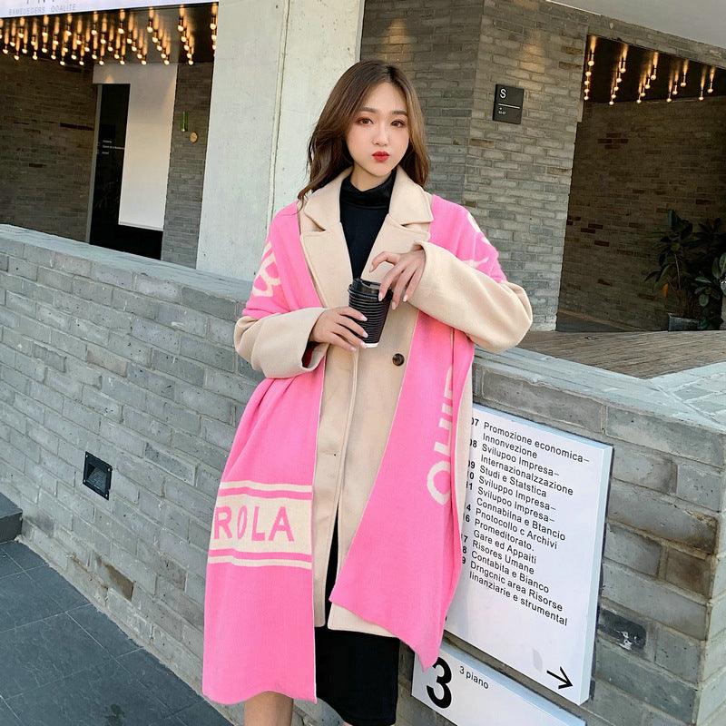 Pink scarf with cream border, striped trim, and “RLA” lettering