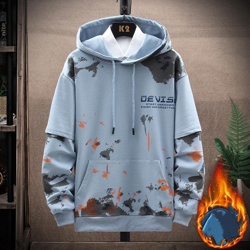 Light blue hooded sweatshirt with camo splatter print and front pouch; short sleeves