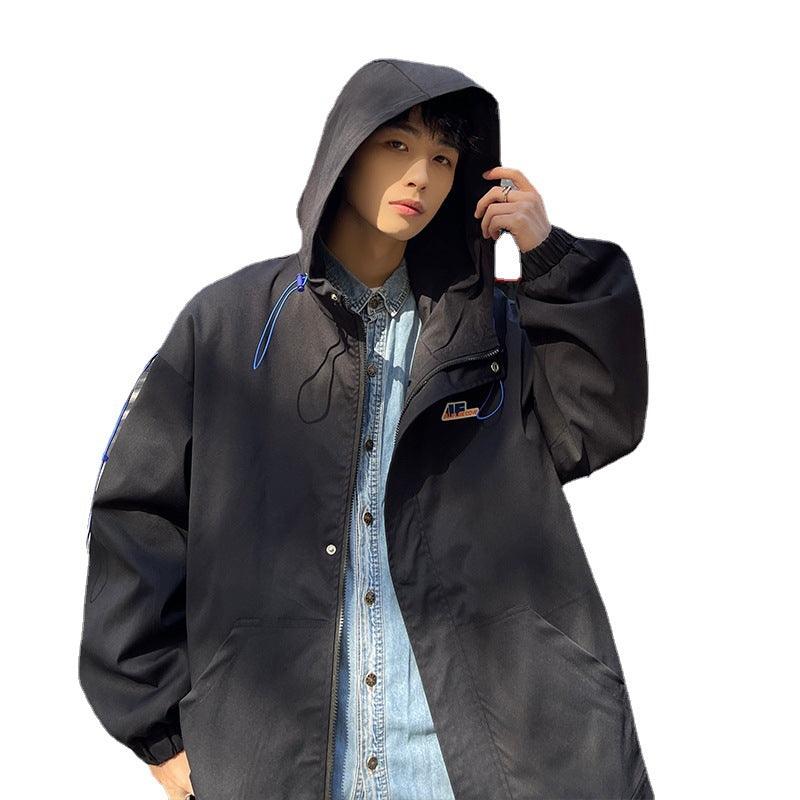 Black hooded jacket with front zipper, blue drawstring cords, logo patch