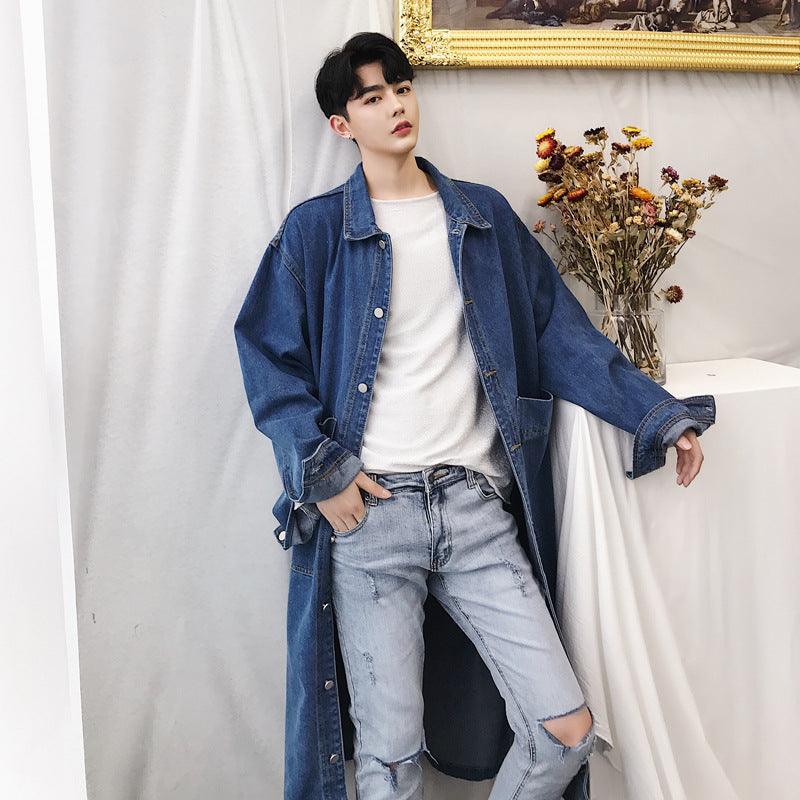 Blue denim trench coat with open front, button details, and chest flap pockets.
