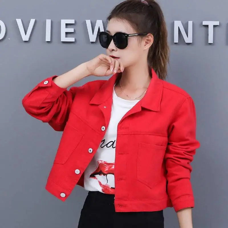 Red short denim jacket with button front, flap pockets, and pointed collar