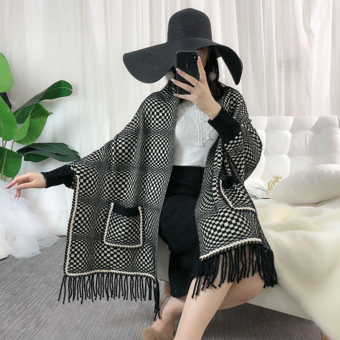 Faux mink velvet cape in black-and-white check, front pockets, fringe trim and tassels