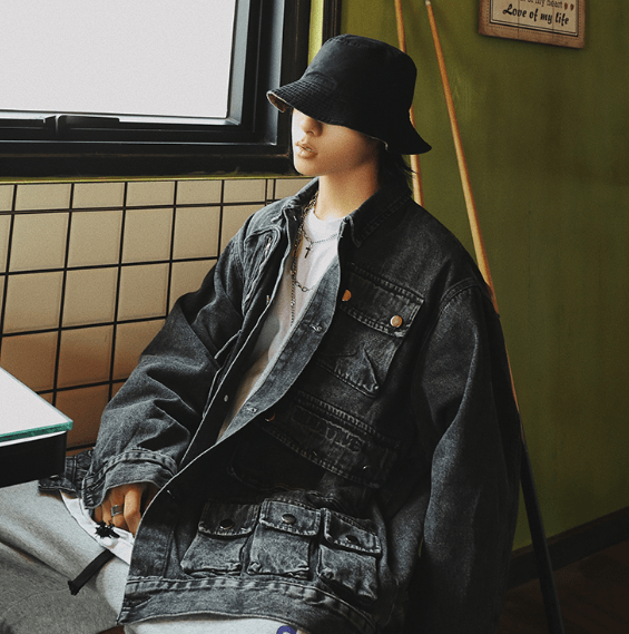 Black multi-pocket denim jacket with button-front and flap chest pockets