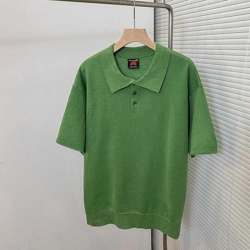 Men's green short-sleeve polo shirt with fold-over collar and 3-button placket.