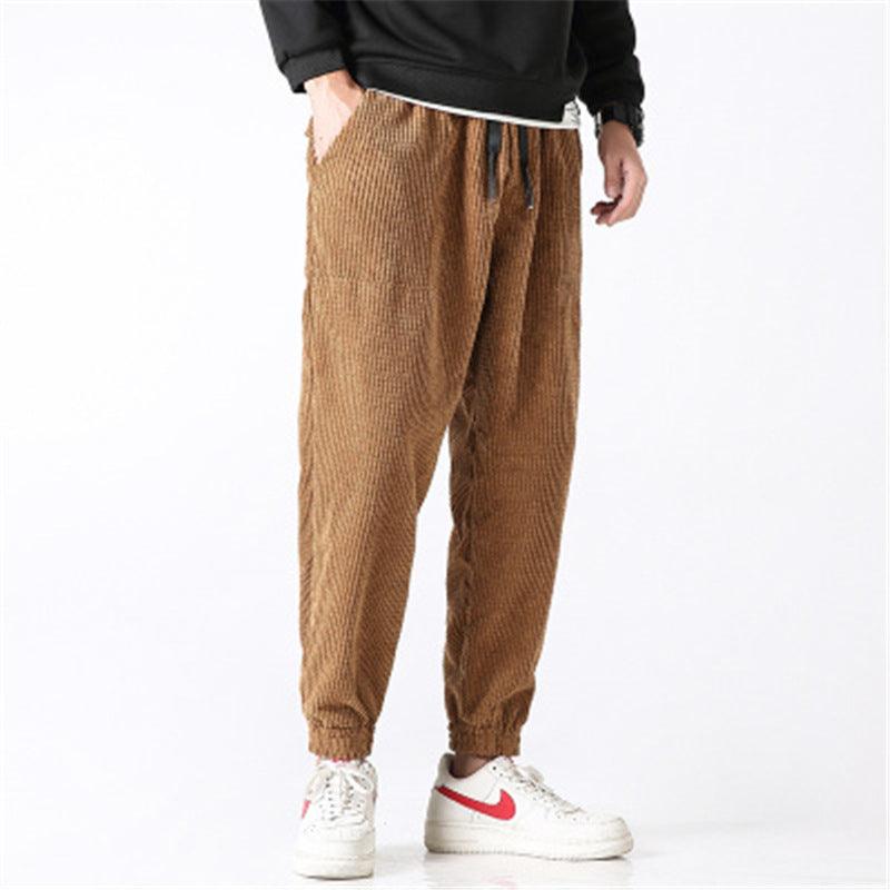 Men's tan corduroy jogger pants with elastic waist and ankle cuffs