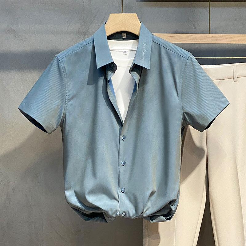 Light blue short-sleeve button-up shirt with pointed collar and front placket