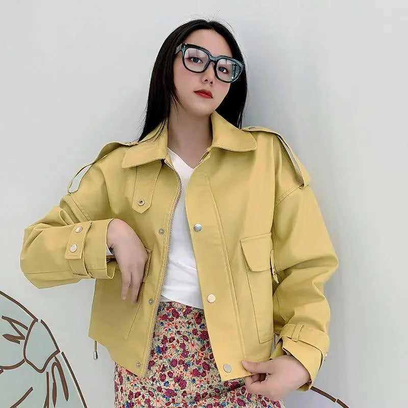 Yellow leather jacket with snap buttons, pointed collar, and two flap chest pockets