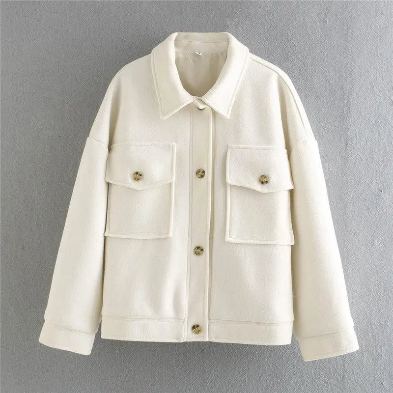 Off-white knit button-up jacket with two chest flap pockets and pointed collar