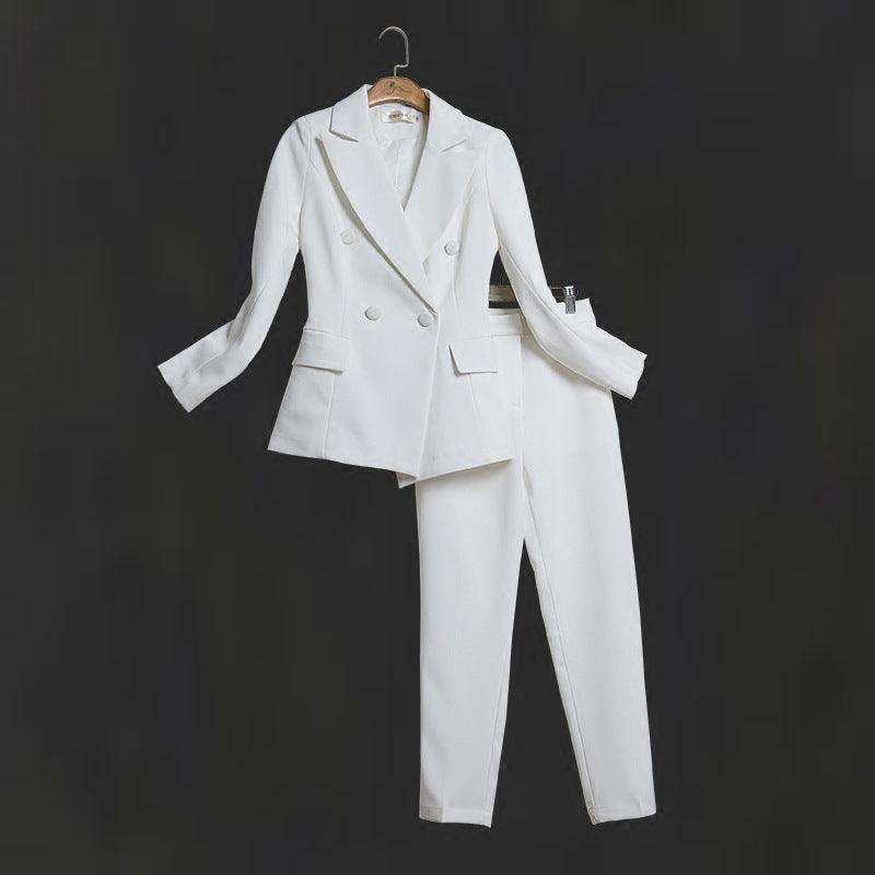 White women's two-piece suit on hanger: double-breasted blazer and straight-leg trousers