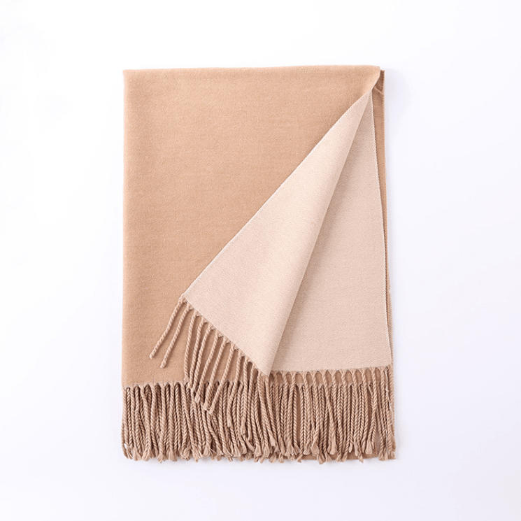 Warm cashmere scarf in beige and cream with soft fringed hem.