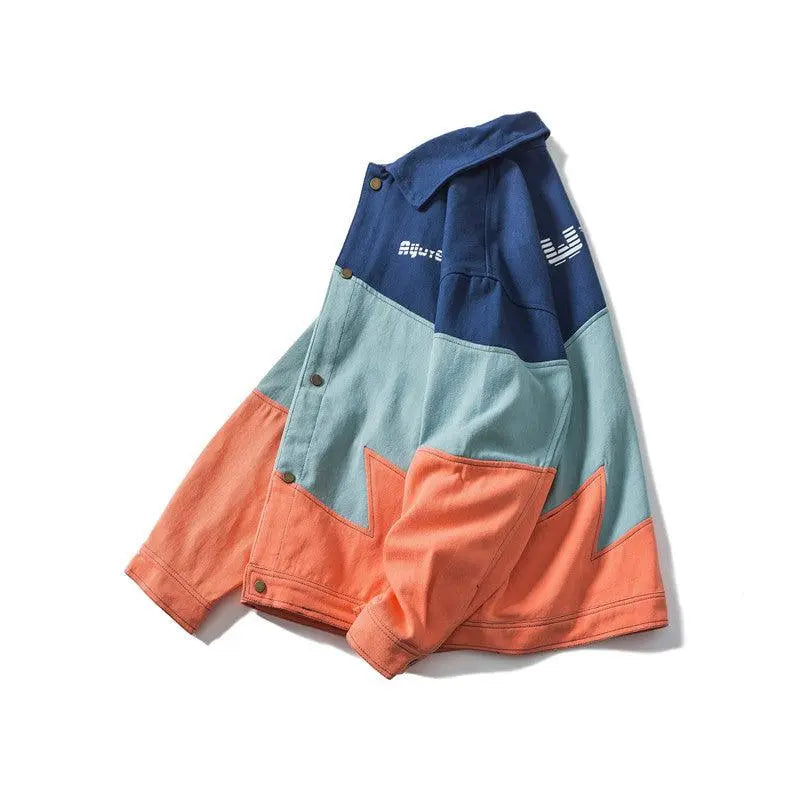 Angled color-block jacket top with stand collar, button placket, blue, mint, and orange panels