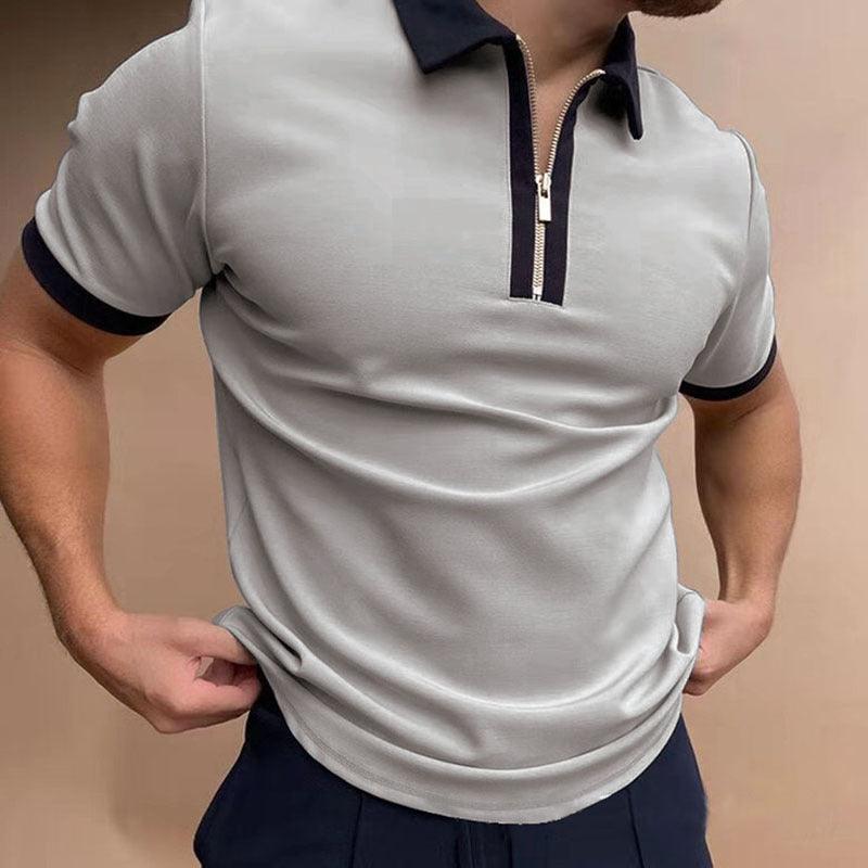 White polo shirt with navy collar and navy-trim zip placket, short sleeves