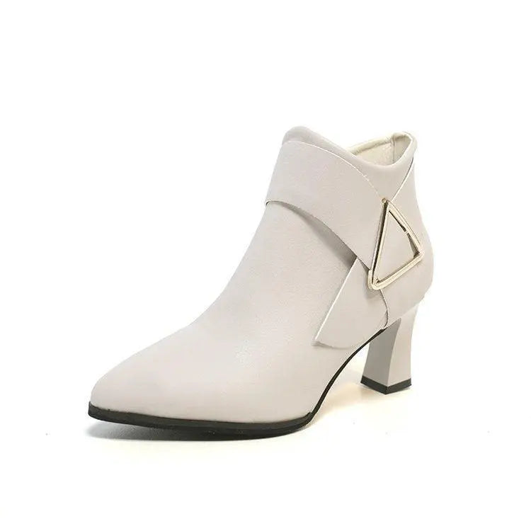 Light beige heeled ankle boot with metal triangle buckle and side strap detail