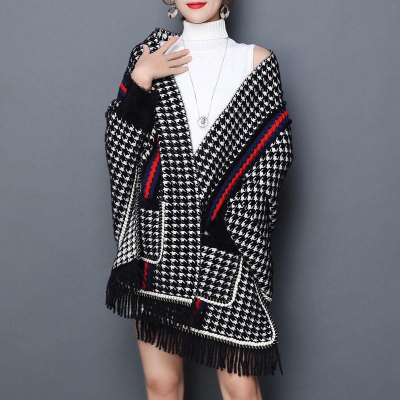 Thick houndstooth shawl, black-and-white knit with red trim and fringed edges