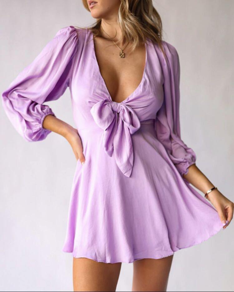 Light purple mini dress with deep V and bow tie front, lantern sleeves
