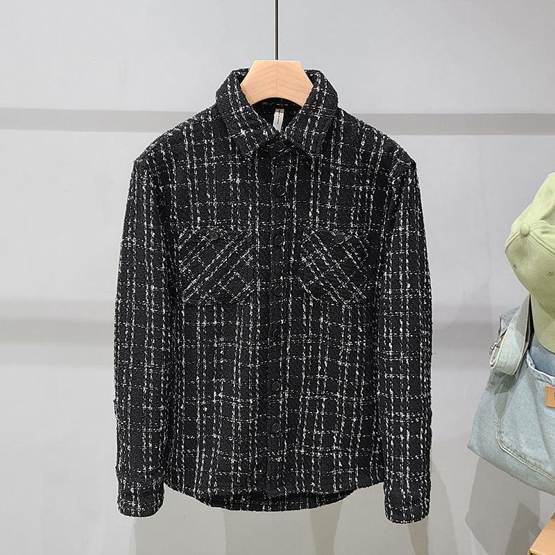 Men's black plaid tweed shirt with button-front and pointed collar on hanger