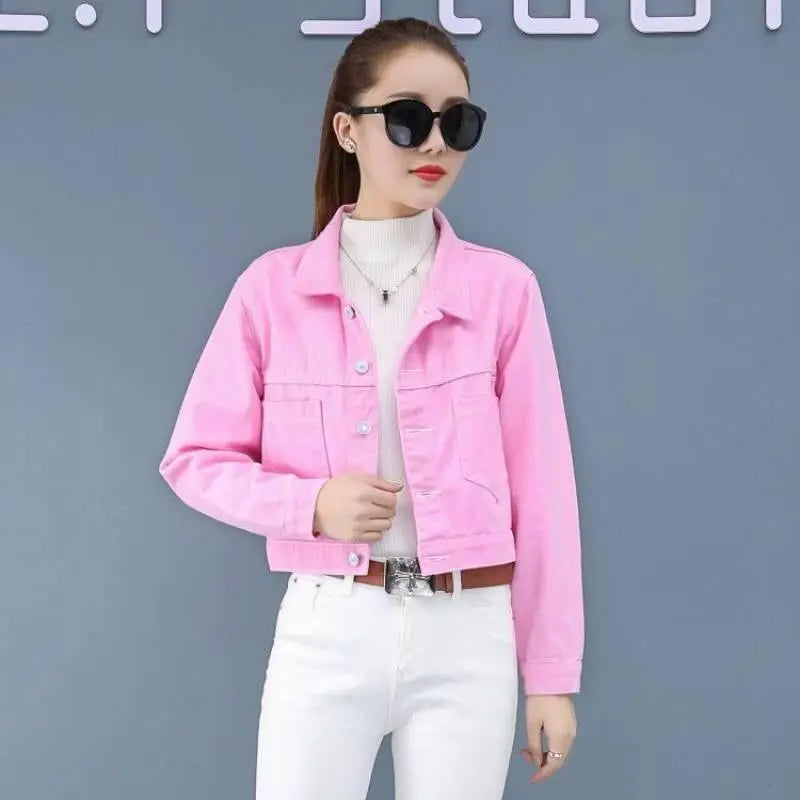 Pink short denim jacket with button front, flap pockets, and classic collar