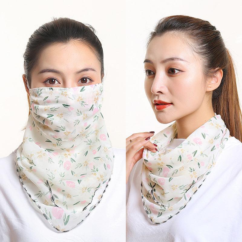 Cream floral bib scarf with matching face covering, draped around neck and mouth