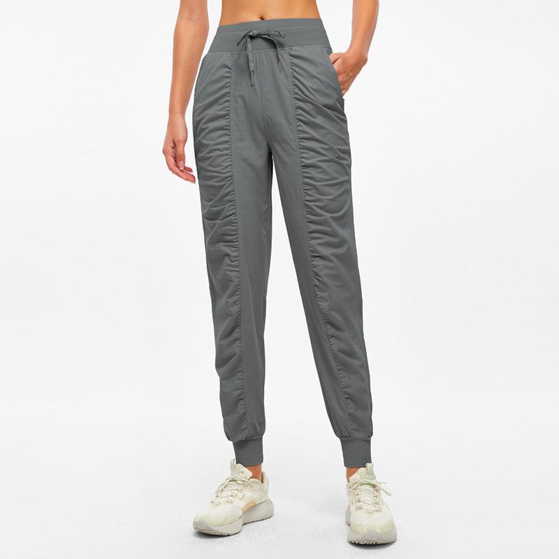 Gray jogger pants with drawstring waistband and tapered ankle cuffs