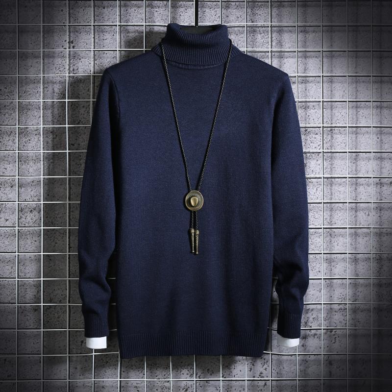 Men's turtleneck sweater in navy blue knit with long sleeves and ribbed cuffs and hem.
