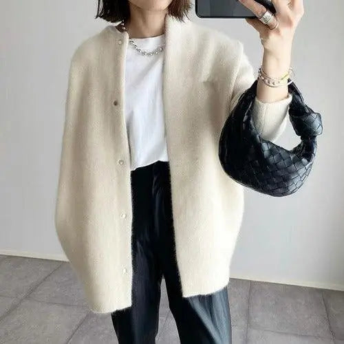 Khaki knitted jacket, button-front cardigan with long sleeves and textured knit.