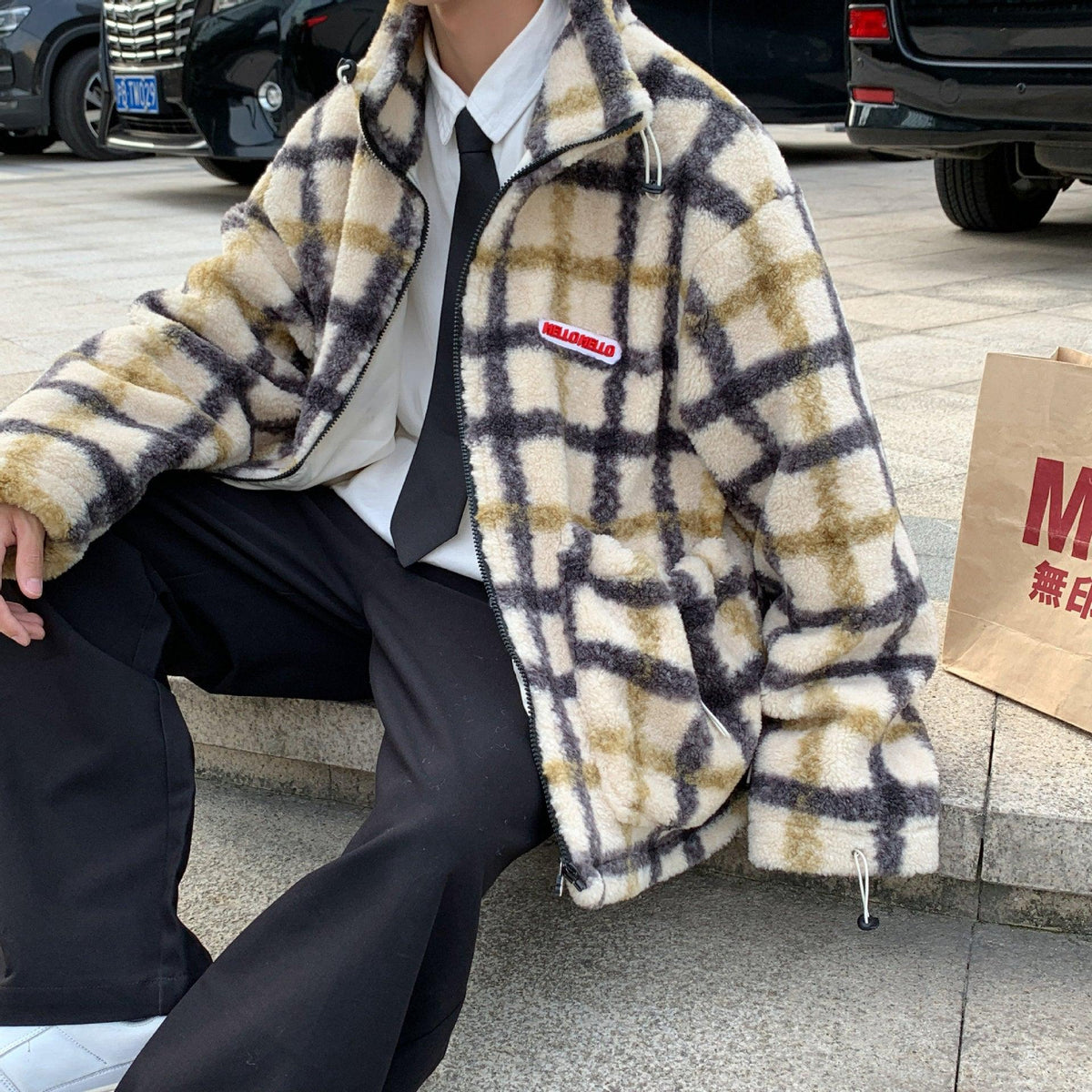 Men's fuzzy plaid zip-front jacket with raised collar and button cuffs