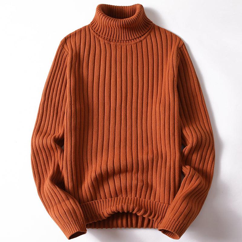 Orange knit turtleneck sweater with thick ribbed texture and long sleeves.