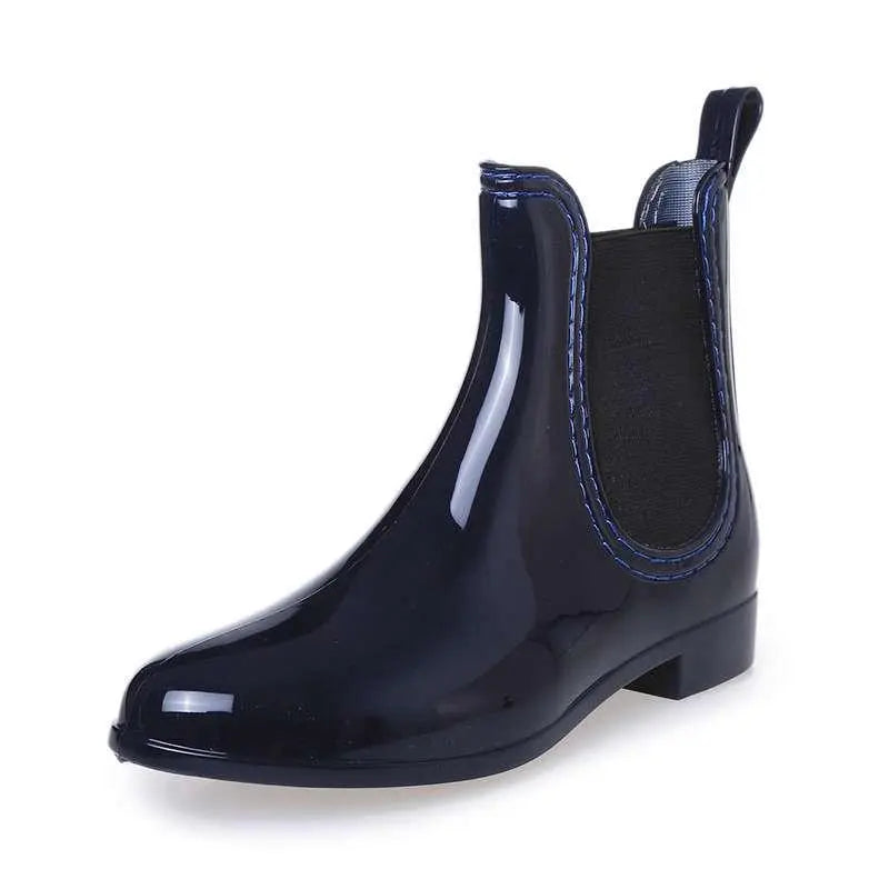 Dark blue waterproof non-slip ankle overshoe boot with elastic side gore and low heel