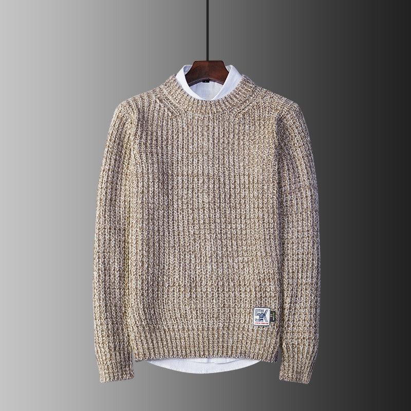 Crew neck sweater in speckled khaki knit, ribbed collar, cuffs, and hem.