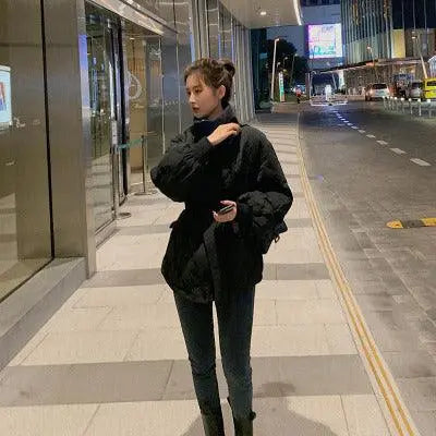 Black quilted short puffer jacket with high neck and front zipper