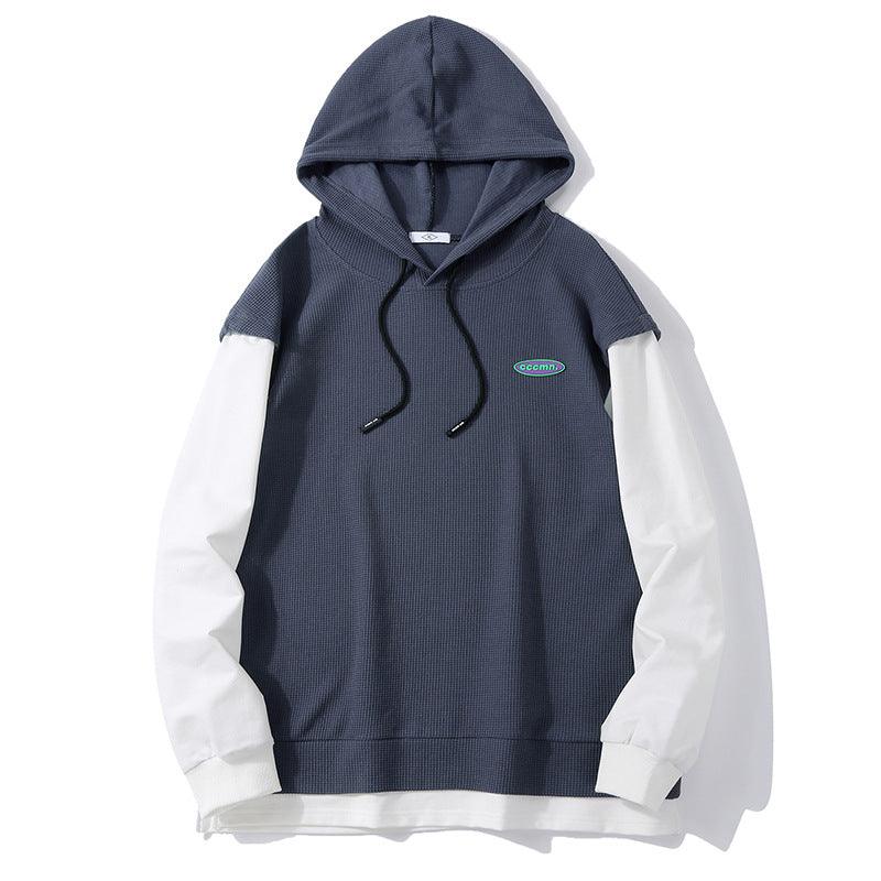 Cotton hooded sweatshirt in dark navy with white sleeves, drawstring hood, and front pouch.